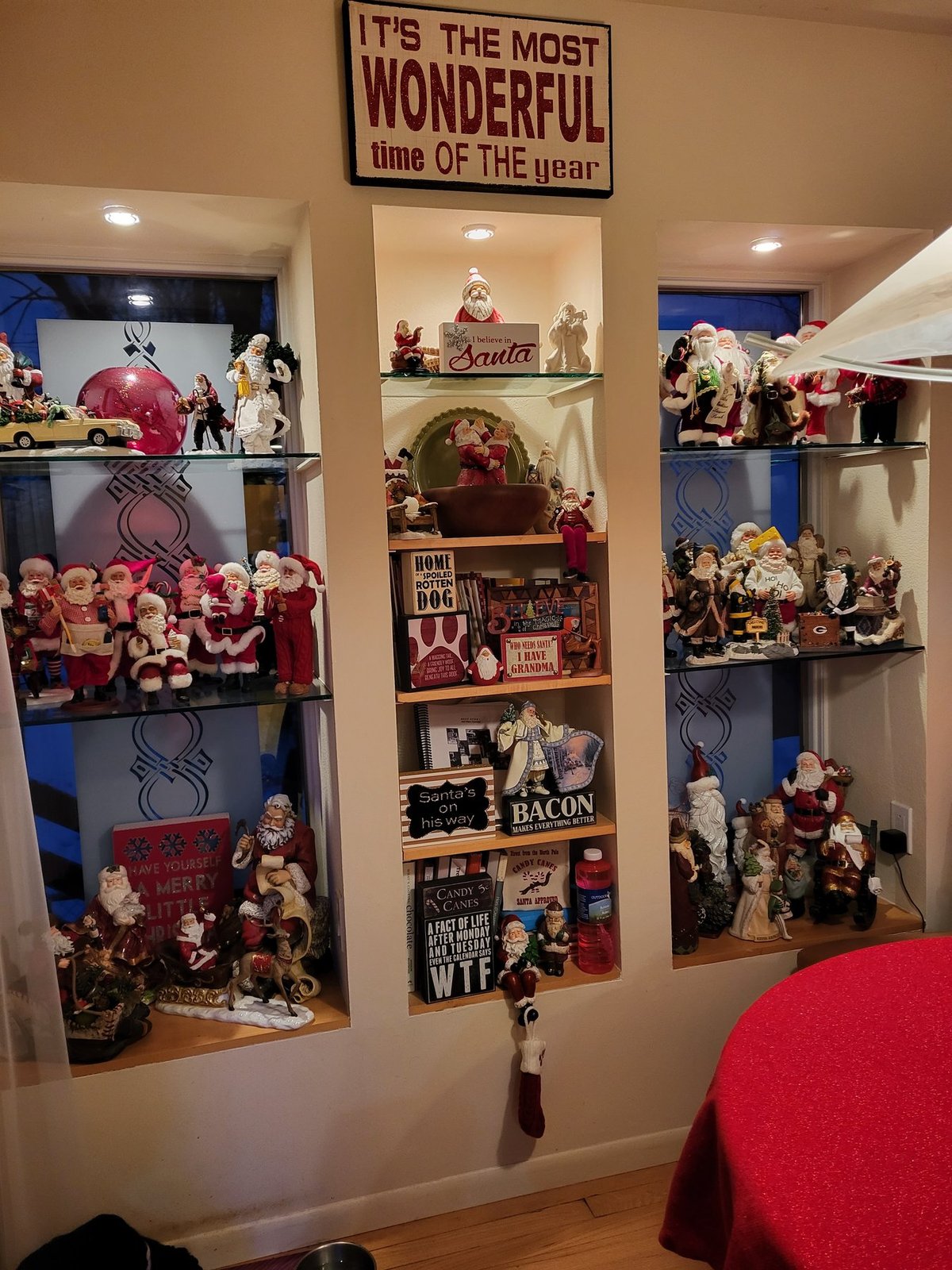 Built in shelves filled with Christmas figurines and holiday signs