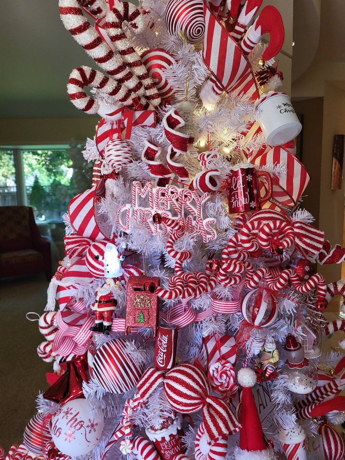 Detail of a candy cane tree with peppermint ribbon and ornaments
